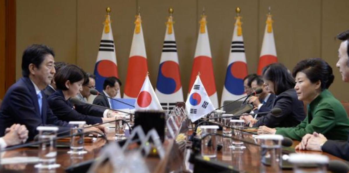Japan, South Korea agree to work to resolve WWII sex slave issue